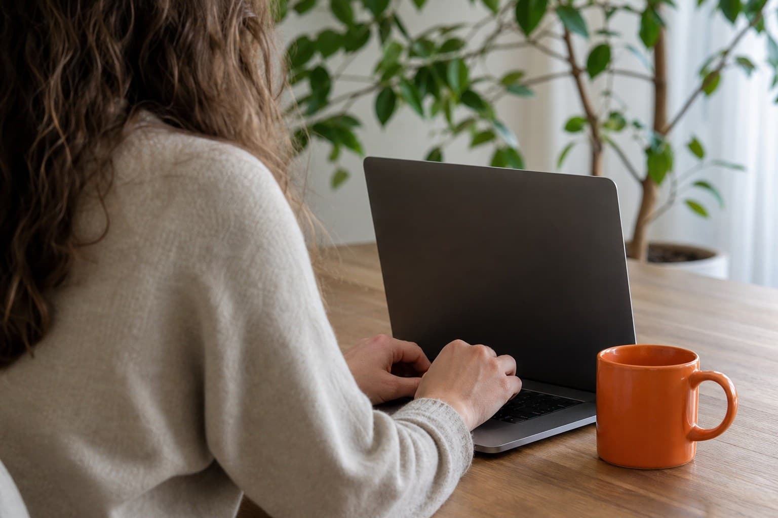 A landlord editing and signing a lease on a laptop